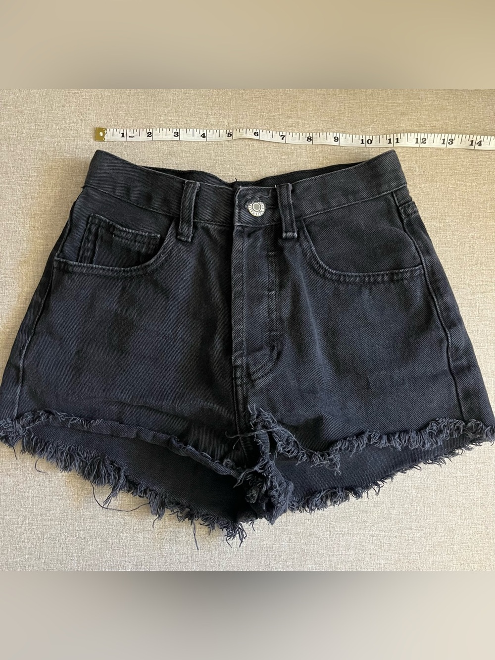 black denim shorts with frayed hem